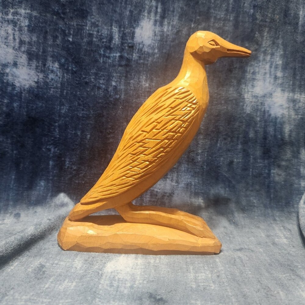 handcrafted hand carved bird made in guatemala.  Beautiful details 7 inch tall